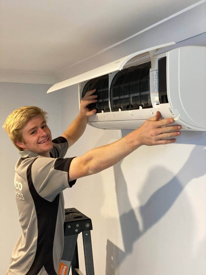 Employee working at Air Con Installation