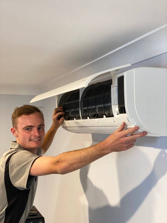 Employee working at Air Con Installation