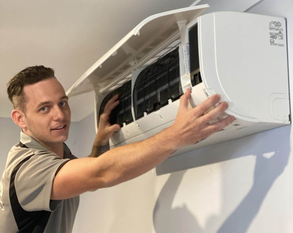 Employee working at Air Con Installation