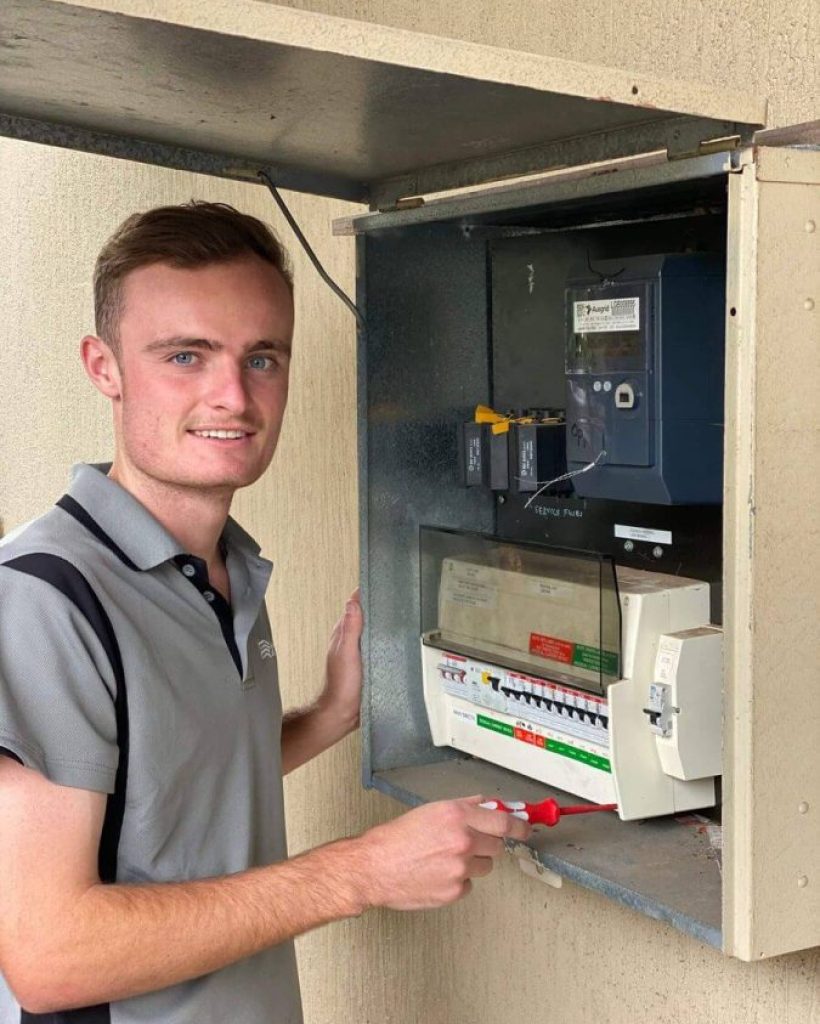 Employee working at Electrical Switchboard