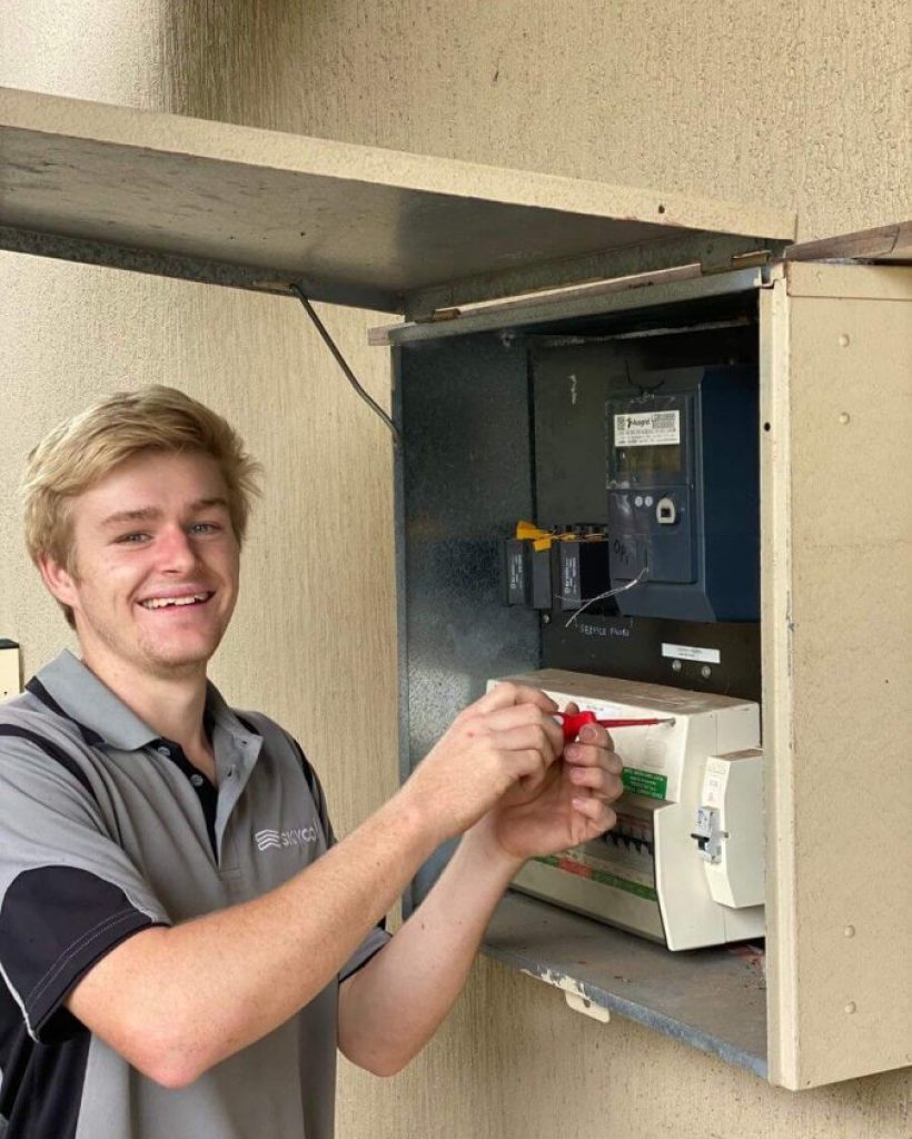 Employee working at Electrical Switchboard